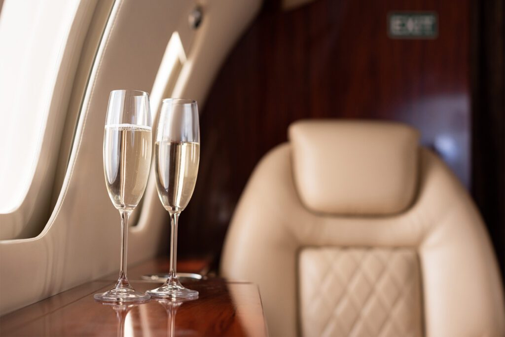 Interior of plane with wine glasses